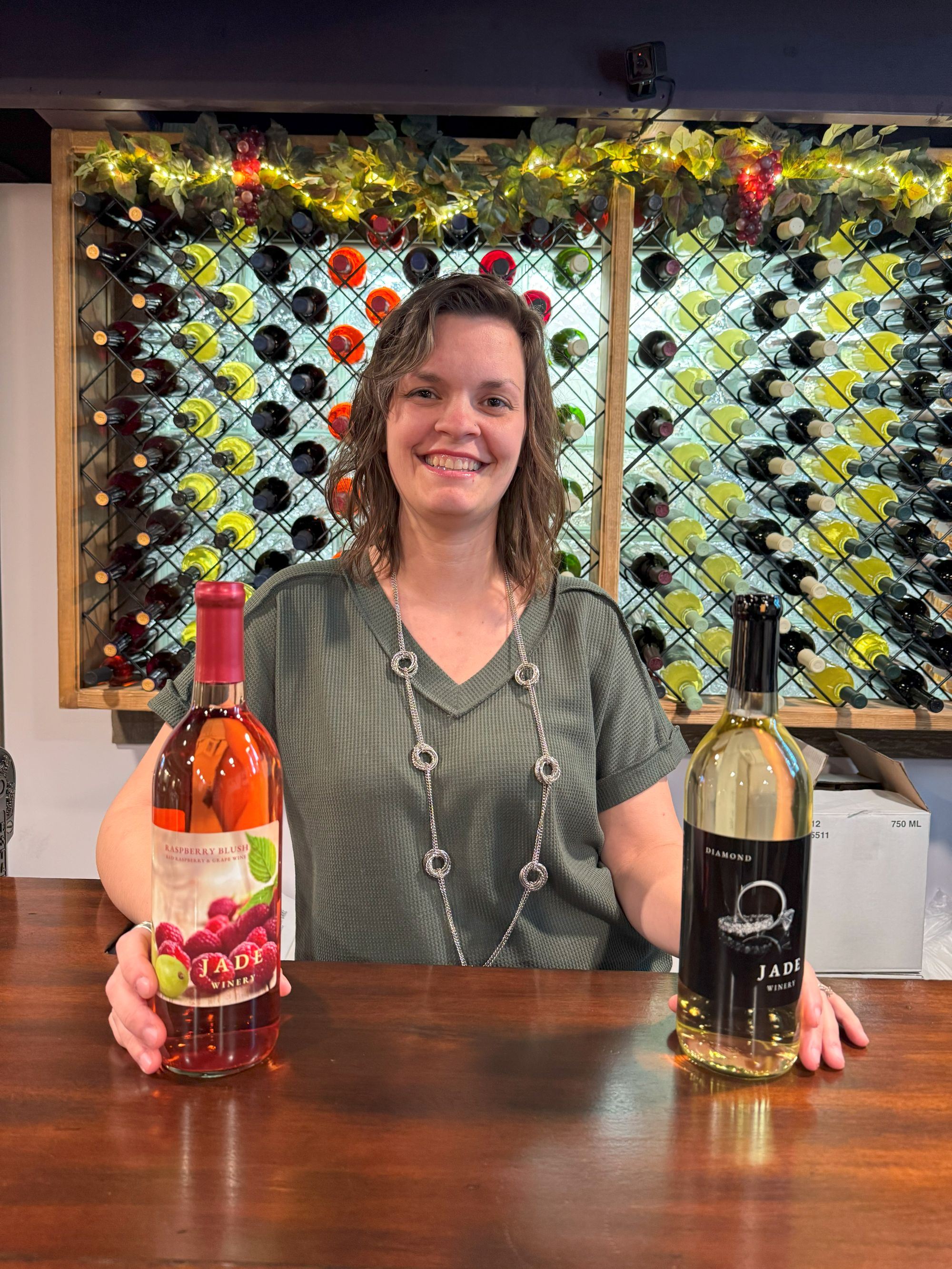 carlie jade winery with wine bottles MM march 2025